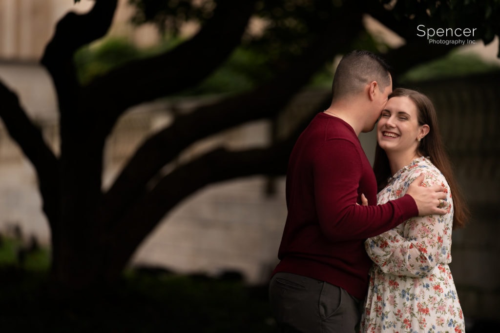 woman laughing in engagement photo in wade oval