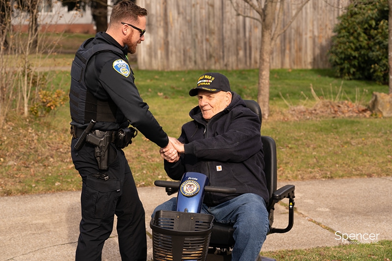 veteran greeting police officer in akron