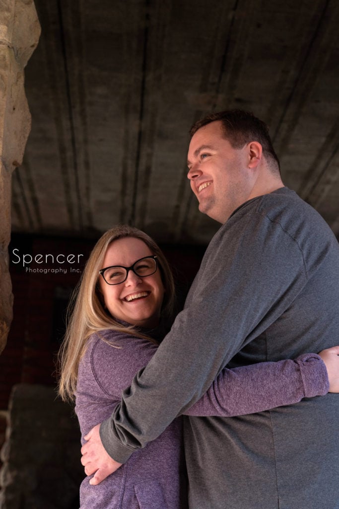 couple laughing in engagement picture at Squire' Castle
