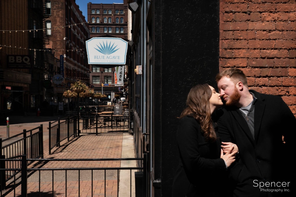 engaged couple kisses on east fourth street Cleveland