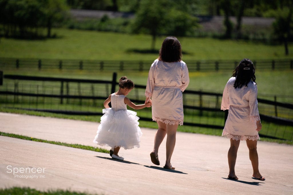  bridesmaid walking with flower girl at Parker Barn