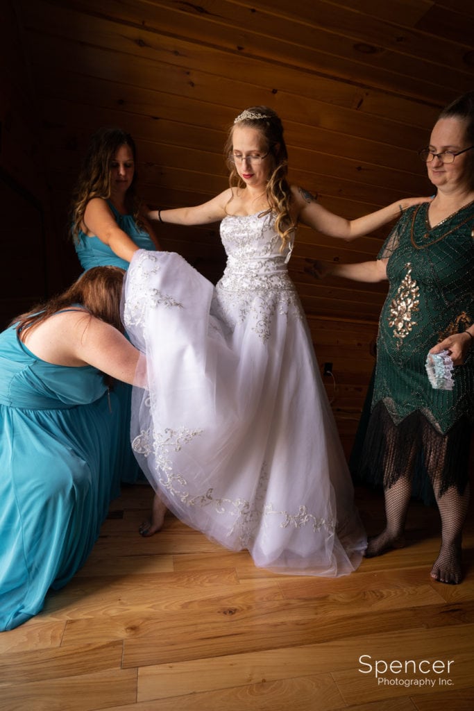 bride putting on wedding garter