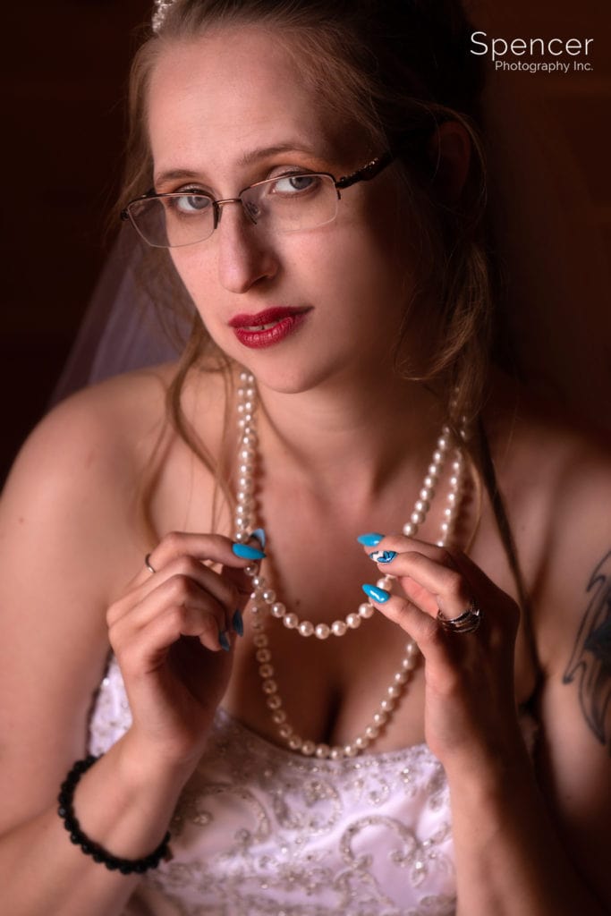 bride holding her necklace