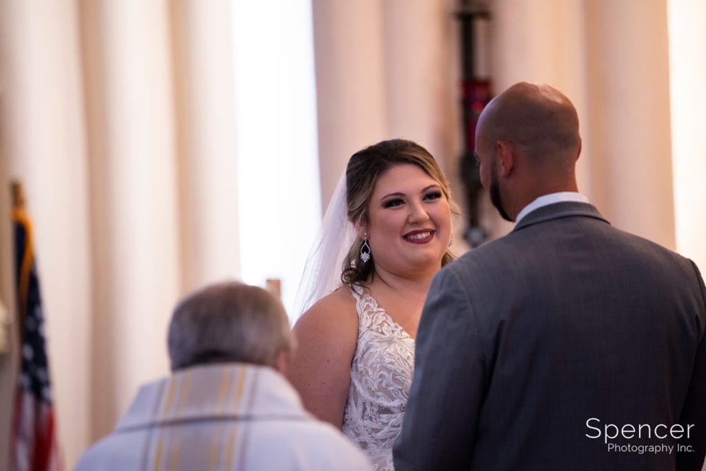 bride looking at groom at St Vincent de Paul Akron