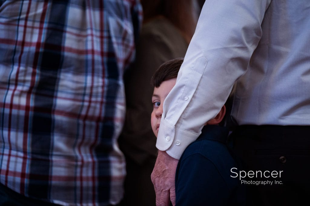 little boy during wedding ceremony at St Vincent de Paul