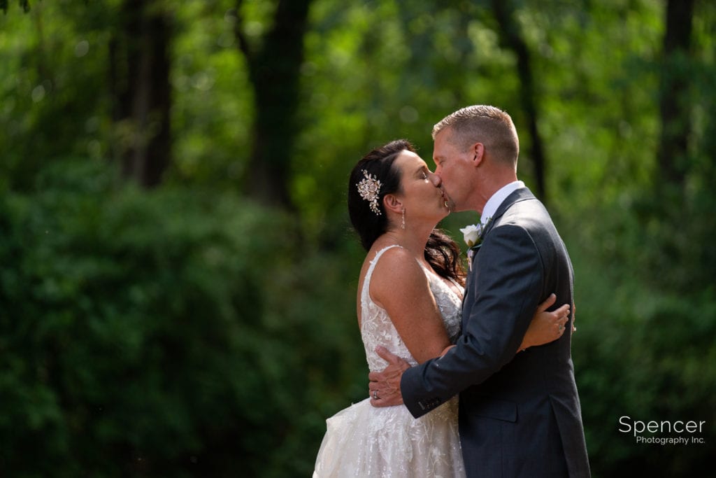 bride and groom kissing after wedding at Gervasi