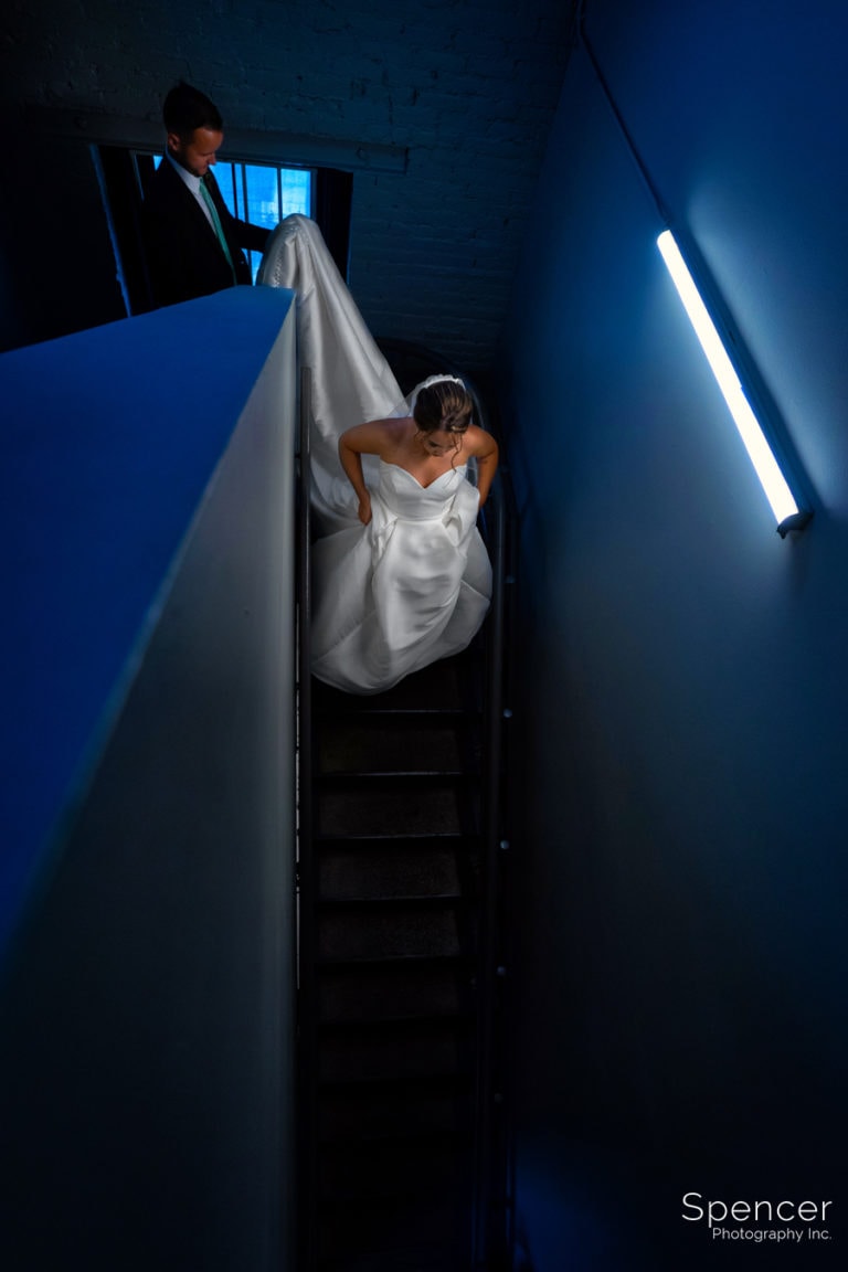 bride and groom walking down stairs at Great Lakes Brewing Company