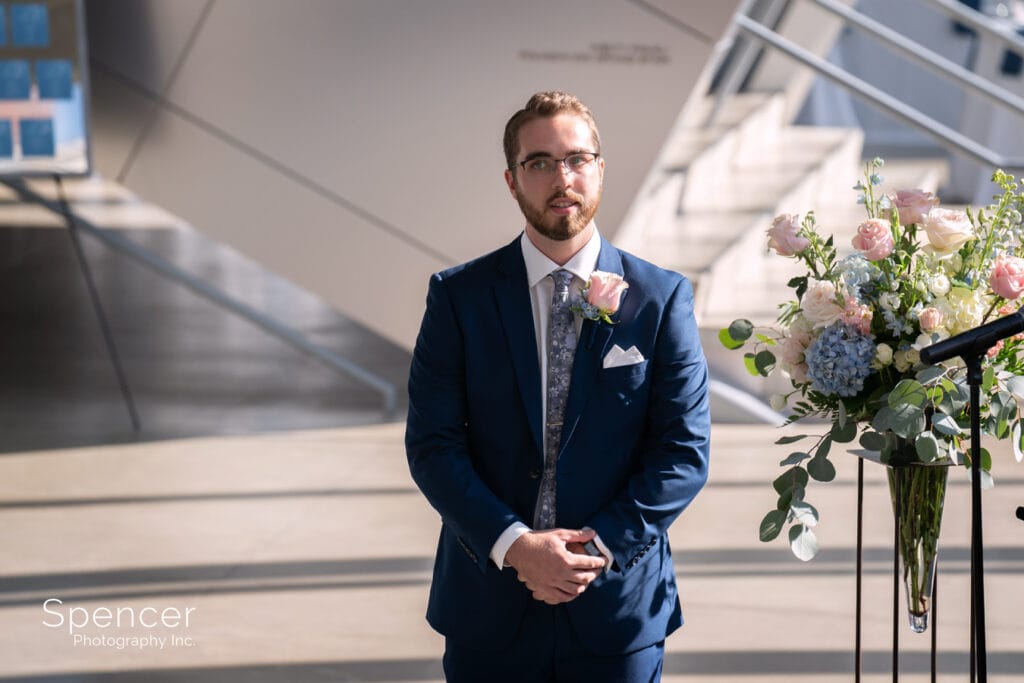 groom at his wedding ceremony at Akron Art Museum