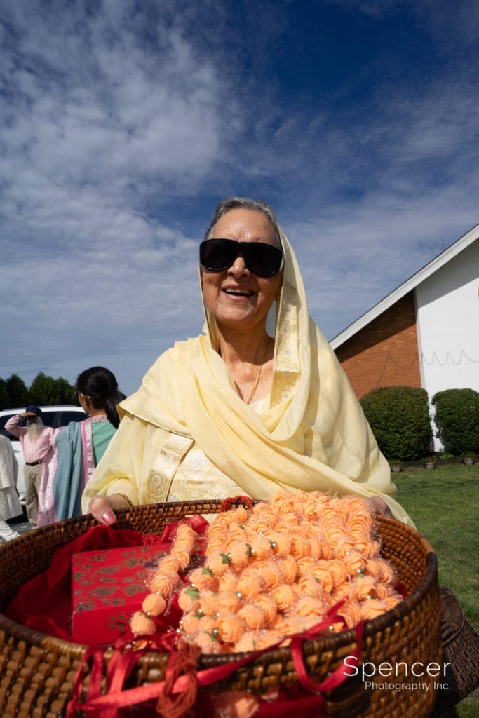 woman holding flowers at Sikh wedding
