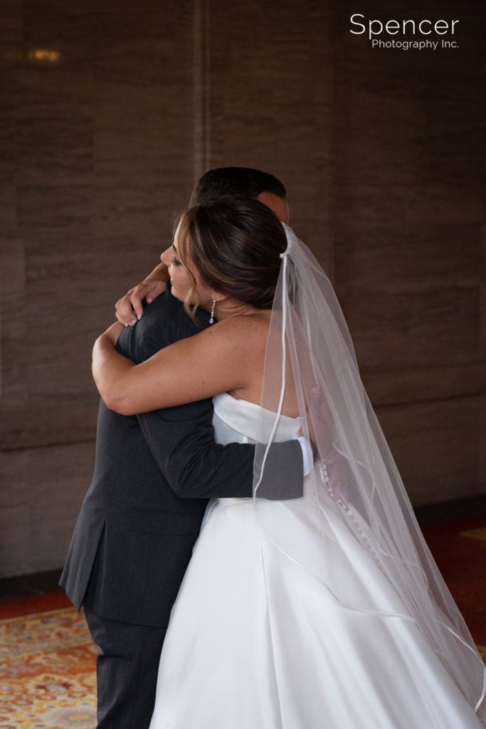 groom hugging bride at Cleveland Renaissance