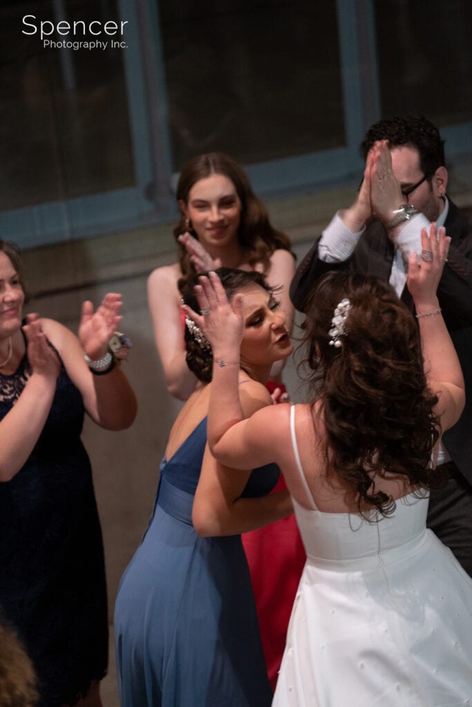 maid of honor dancing with bride
