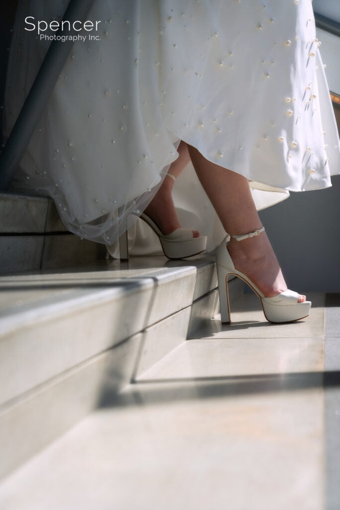 bride walking down stairs at Akron Art Museum