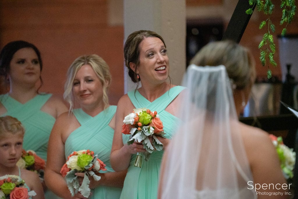 matron of honor laughing during wedding at Great Lakes Brewing Company