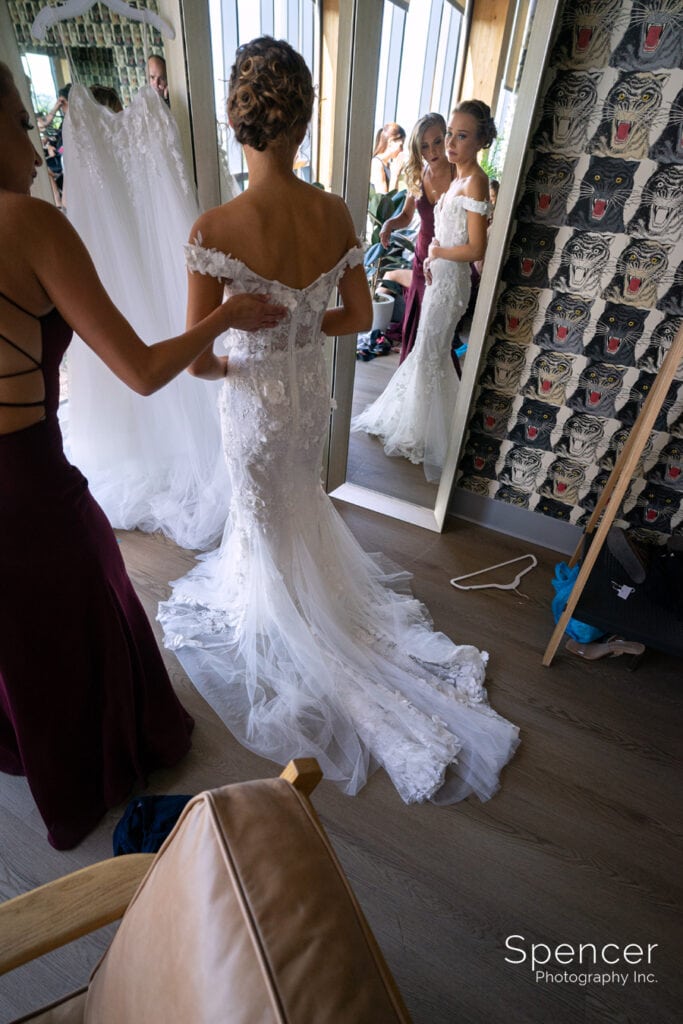 final touches on wedding dress at Truss