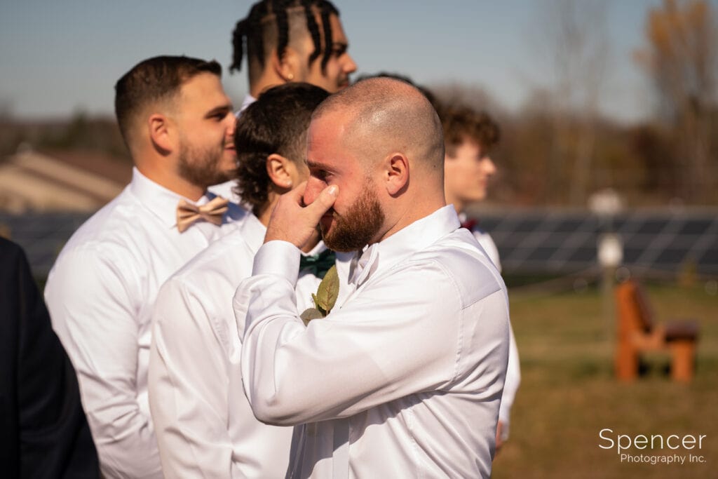 groom getting emotional at wedding at Wadsworth White Timbers