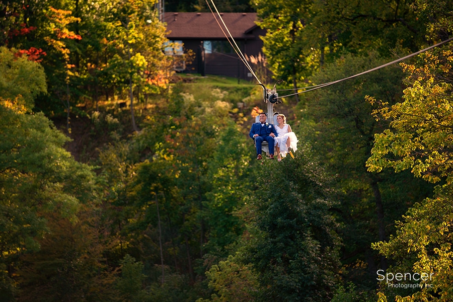 bride and groom on zip line at Cleveland Zoo