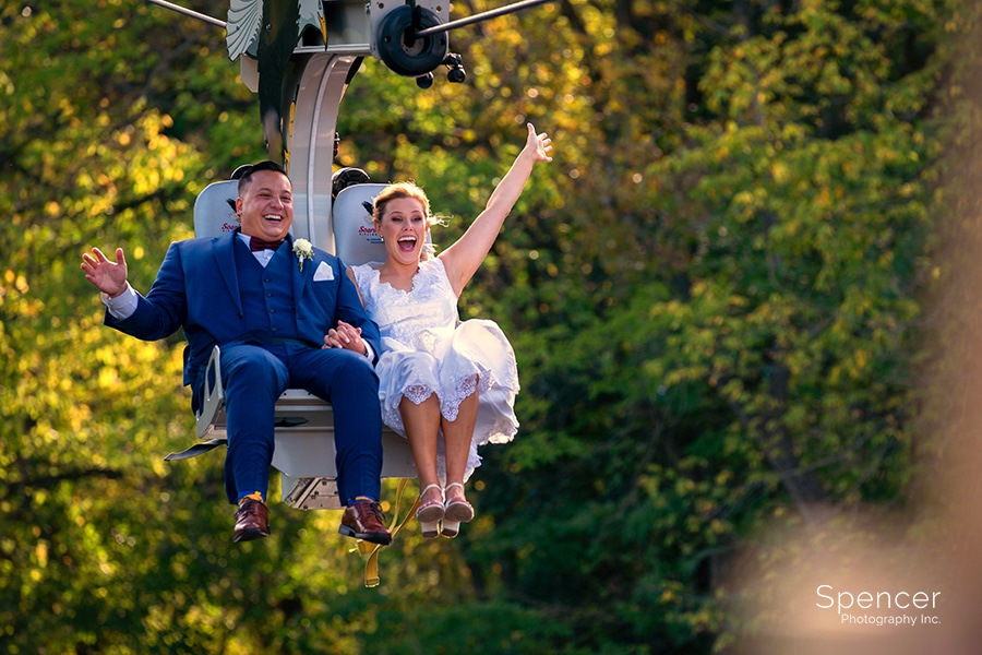 bride laughing on zip line a Cleveland zoo