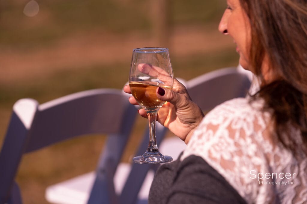 woman drinking wine at wedding at White Timbers Winery