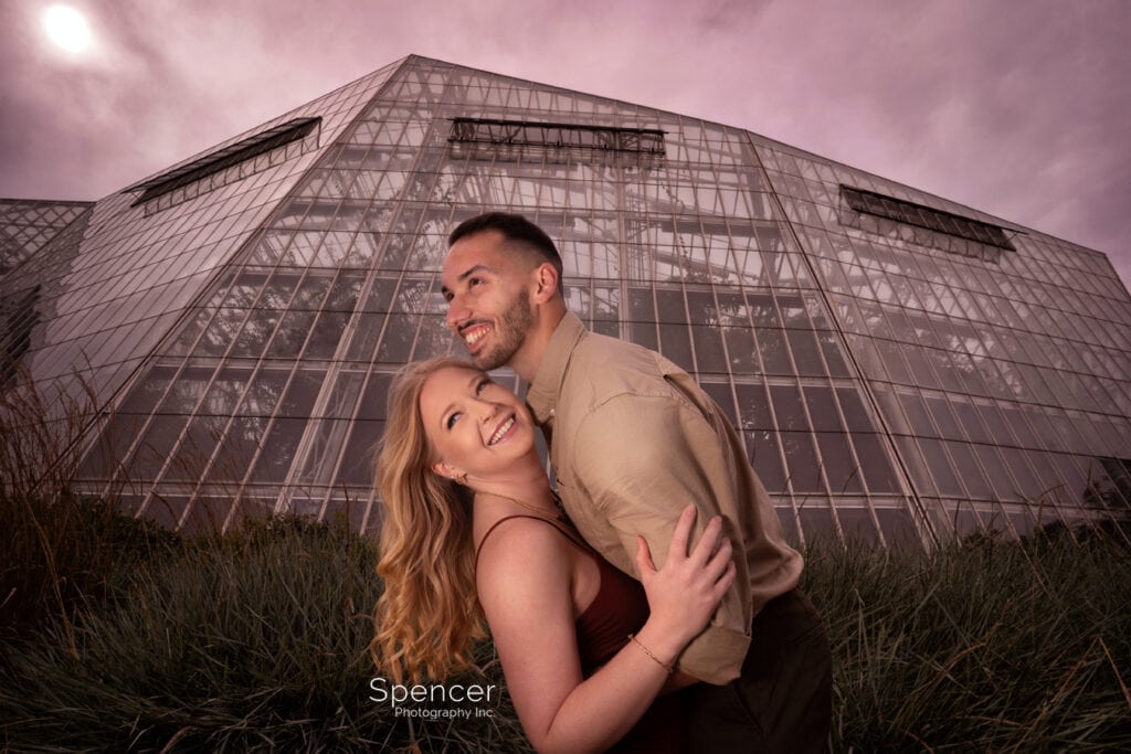 couple hugging in engagement photo at Cleveland Botanical Garden