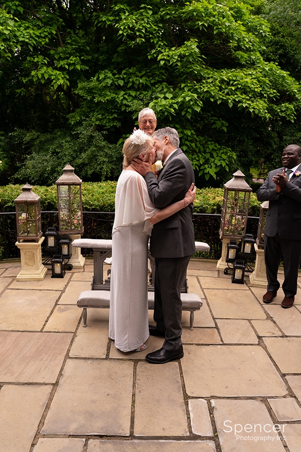 first kiss at wedding ceremony at O'Neil House Akron