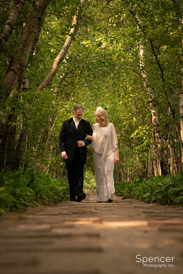 bride and groom walking in Birch Alley