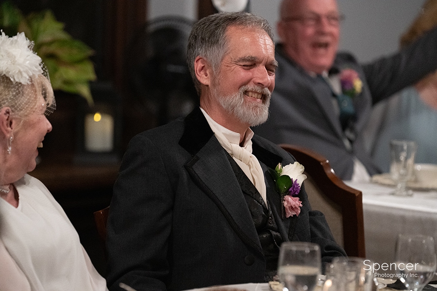 Groom laughing at reception at O'Neil House