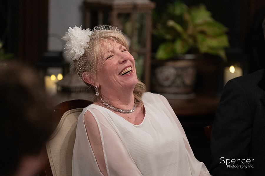 bride laughing at O'Neil house reception