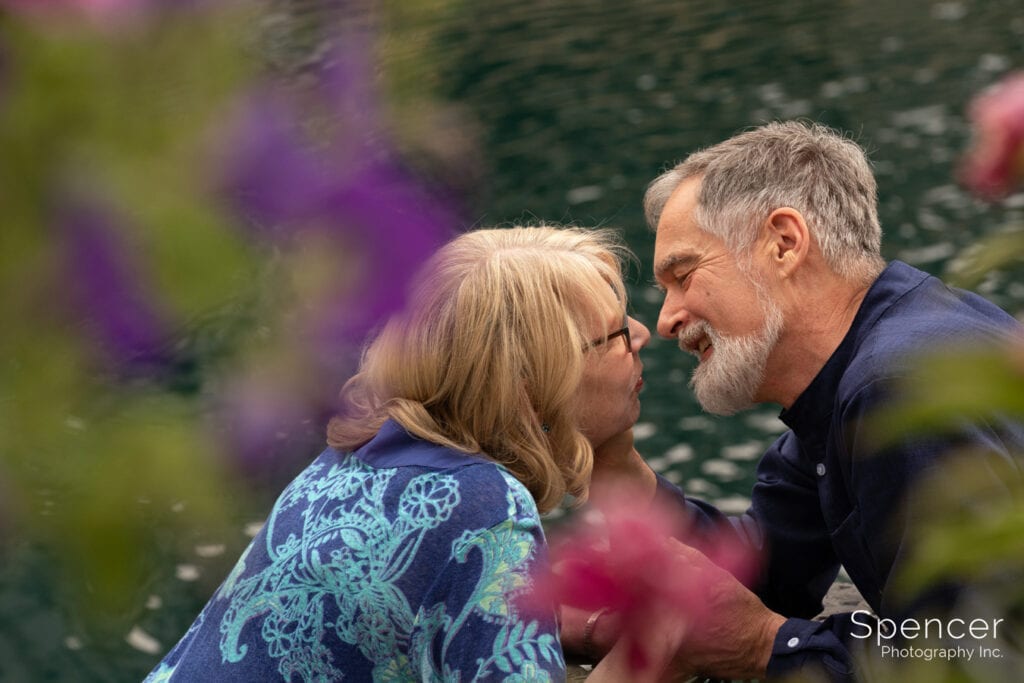 couple kissing at pond in akron engagement pictures