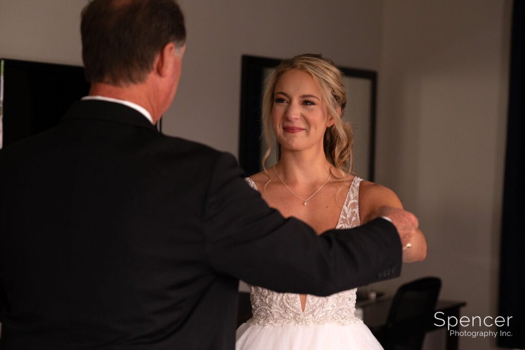 bride seeing dad for first time on wedding day
