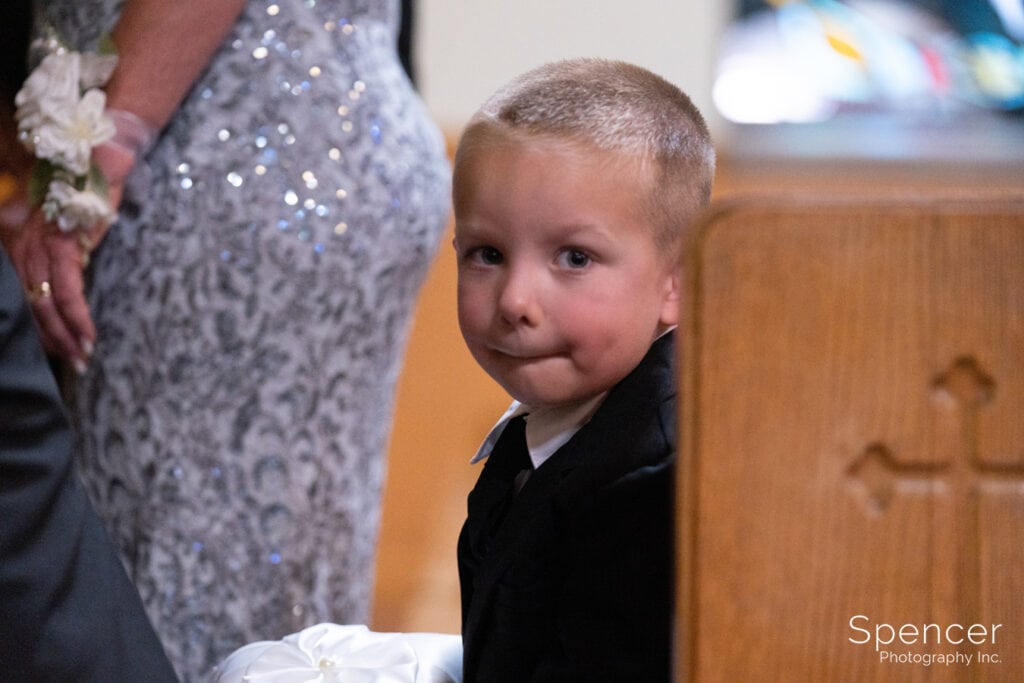 little boy during wedding at st patrick church in Kent