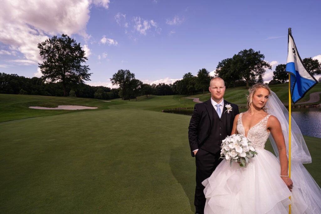 bride and groom on green at Firestone