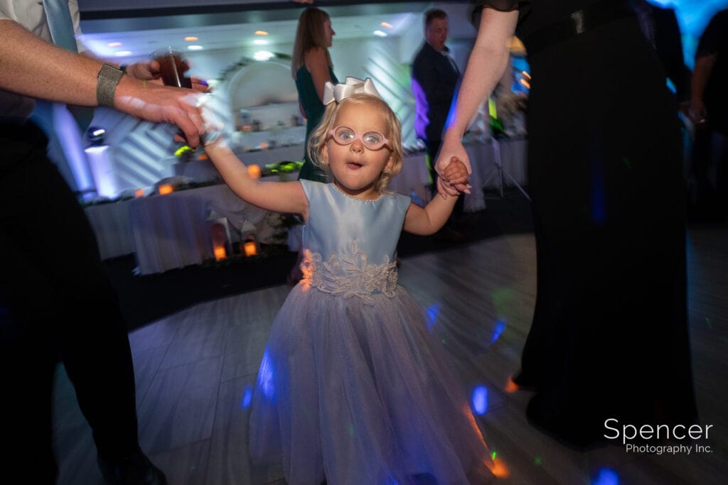 little girl dancing at wedding reception