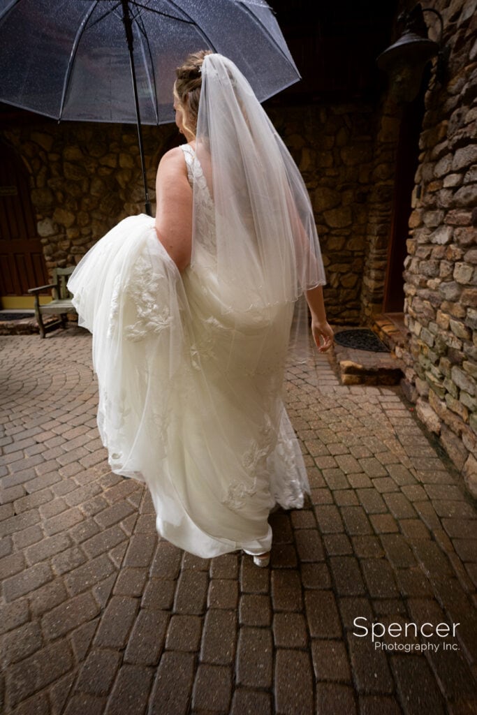 bride walking to first look at Landolls Mohican Castle