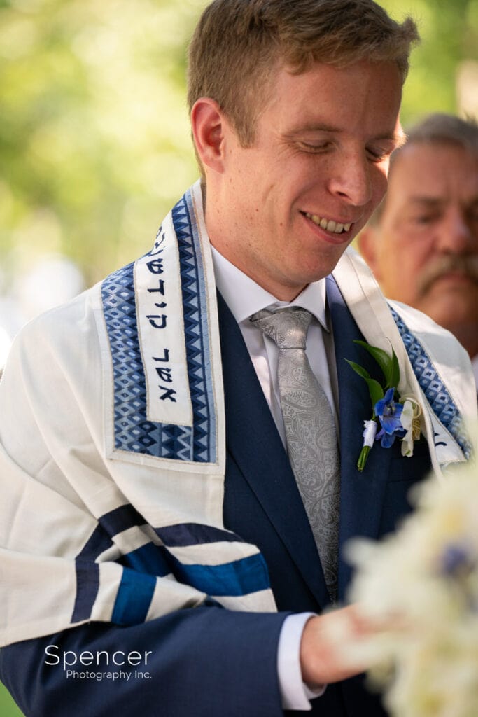 groom during jewish wedding ceremony at Landolls