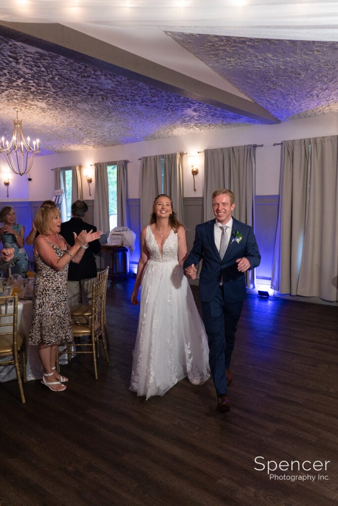 bride and groom entering reception at Landolls