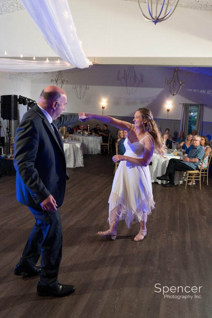 bride dancing with dad at wedding reception