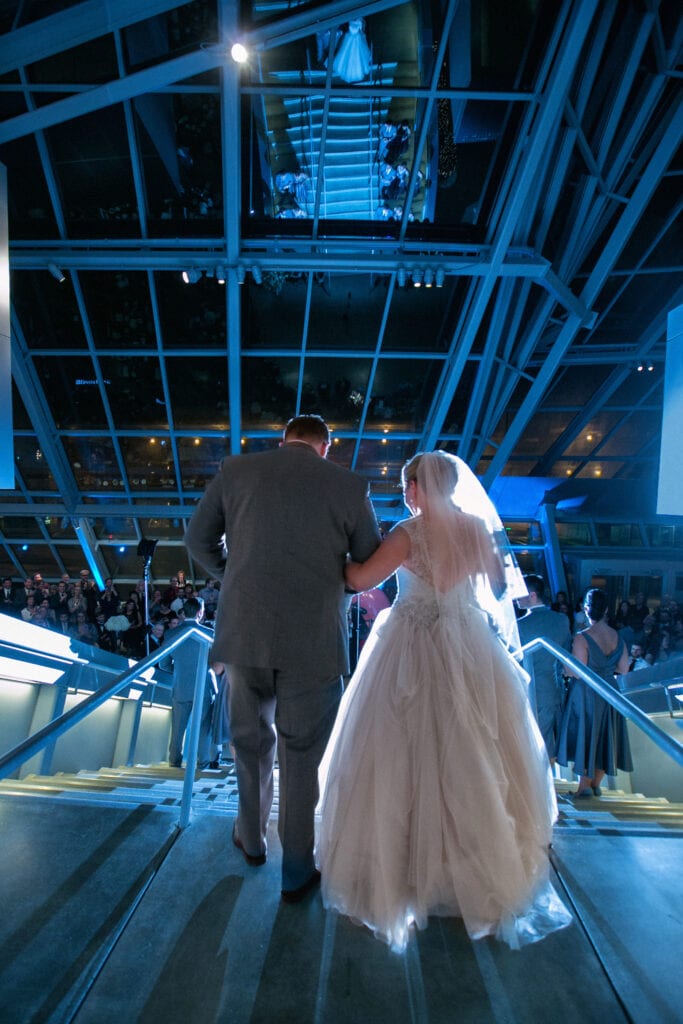 Bride and groom entering Akron Art Museum wedding reception