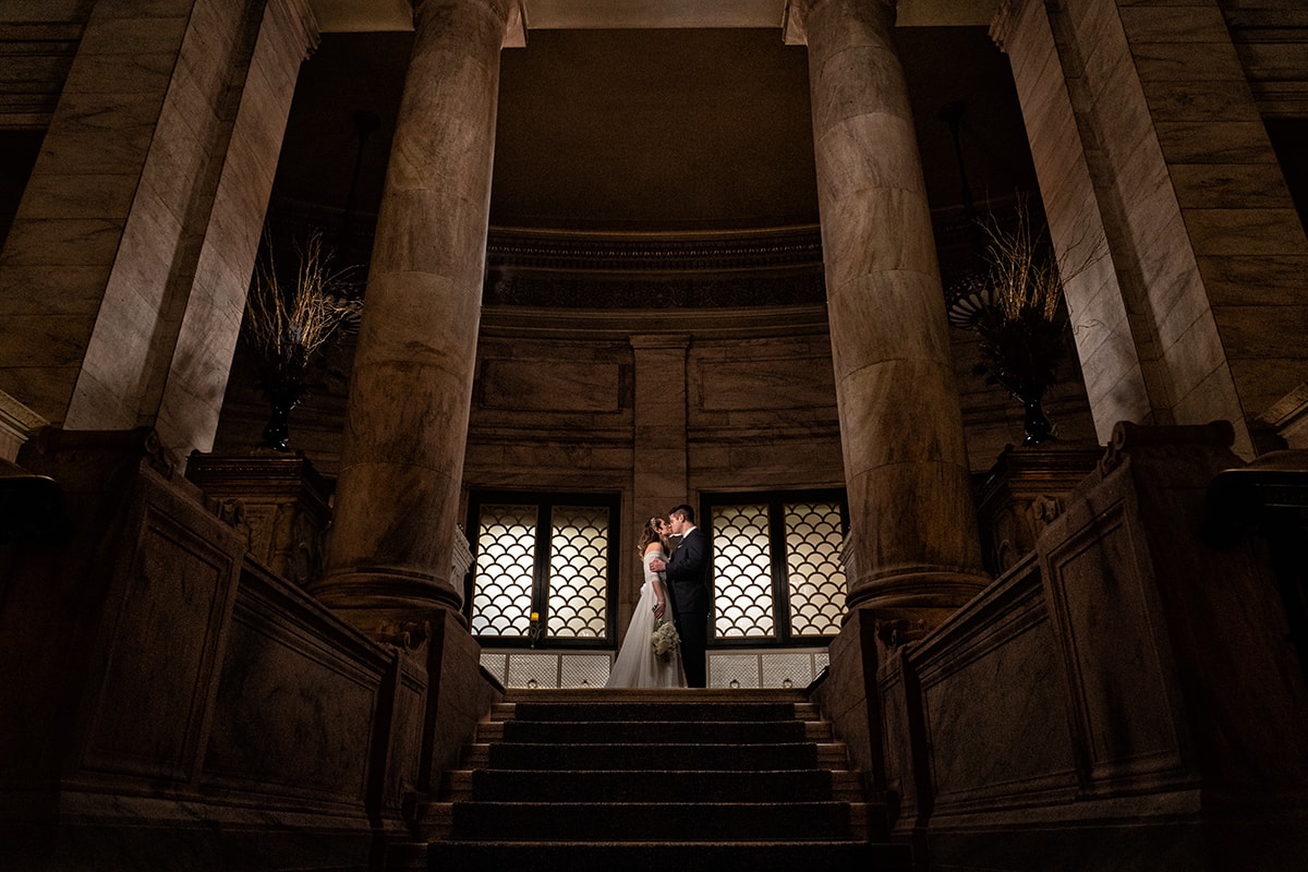 bride and groom kissing at their wedding at The Marble Room Cleveland