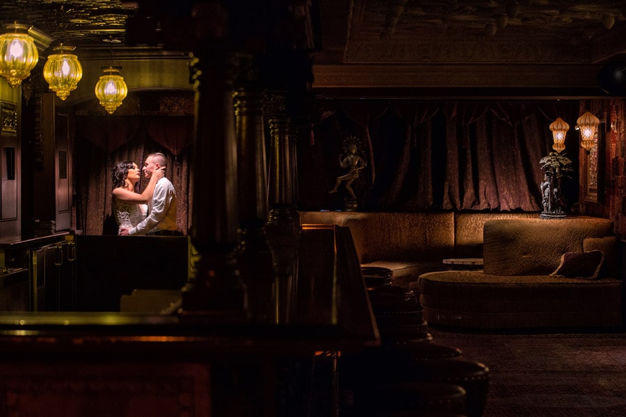 bride and groom kissing in foundation room at House of Blues Cleveland