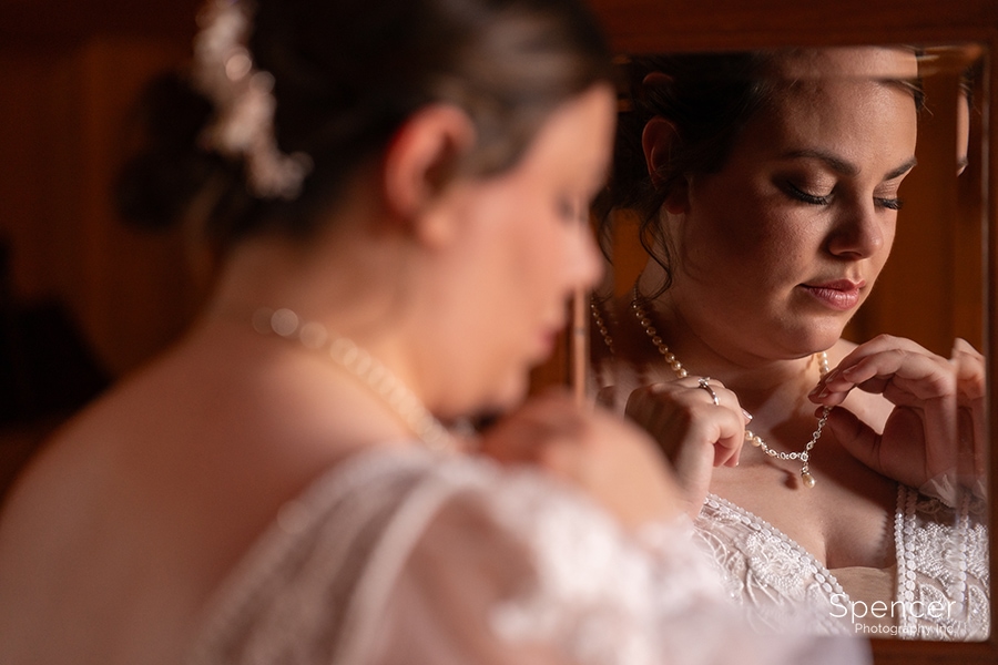 bride adjust necklace at Vrooman Mansion