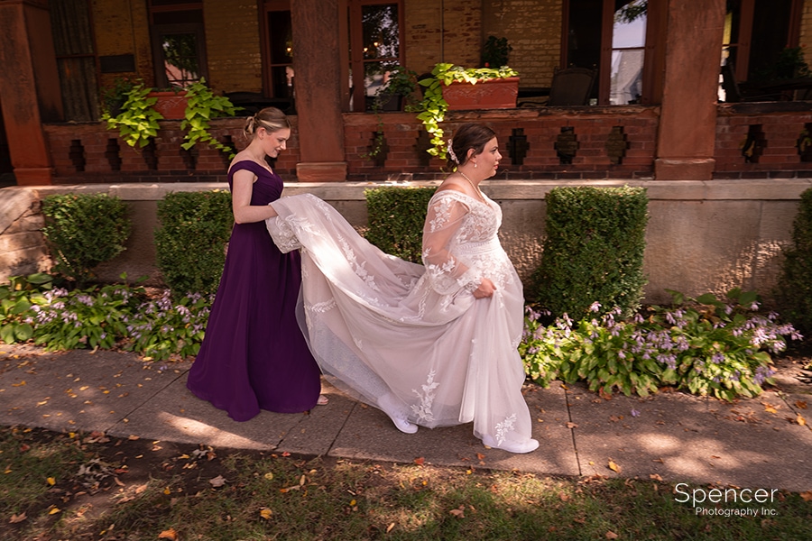 maid of honor walking with bride at Vrooman Mansion