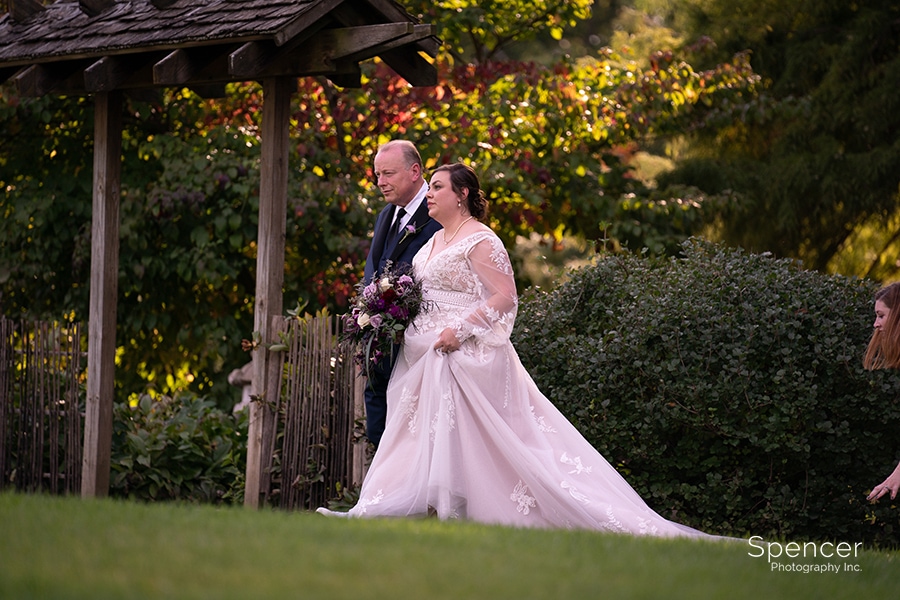 dad walking bride to wedding ceremony at Ewing Manor