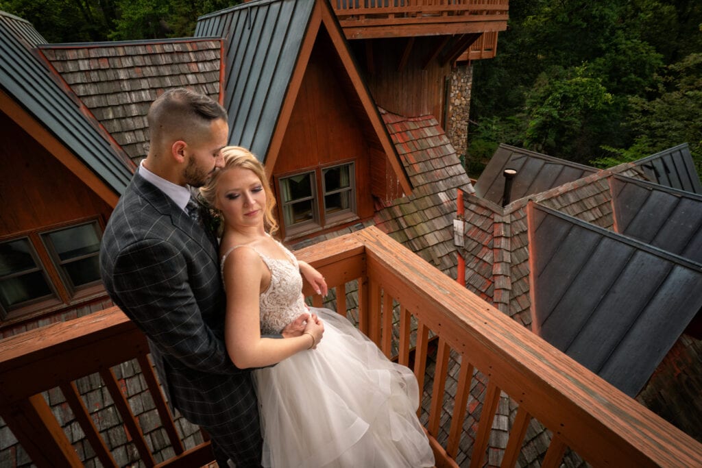 bride and groom on top of Landoll's Mohican Castle