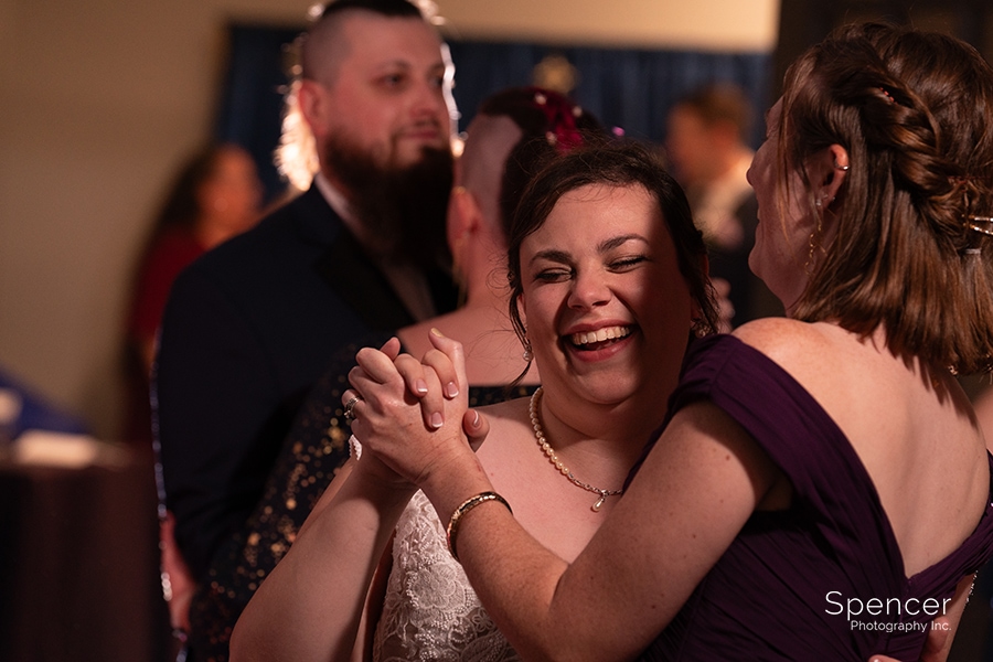 bride laughing on dance floor