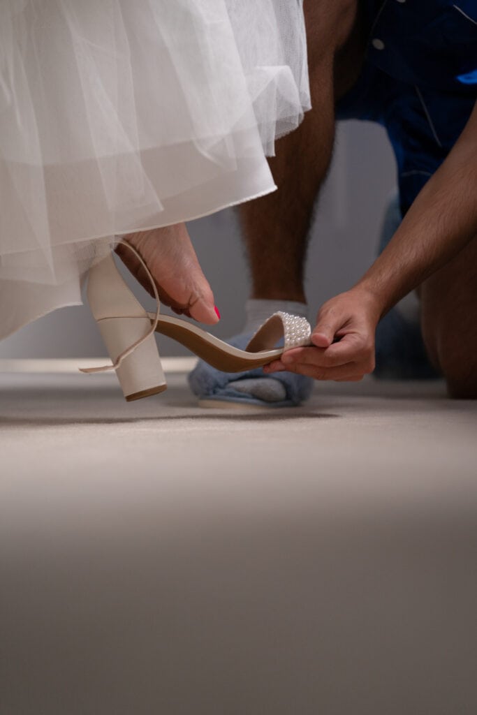 bride's foot going into shoe