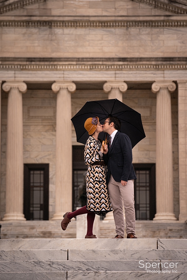 Couple kissin during summer engagement pictures at Cleveland Museum of Art