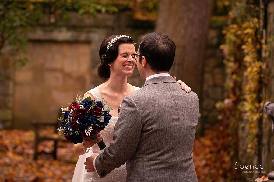bride and groom hugging at fall wedding at Stan Hywet