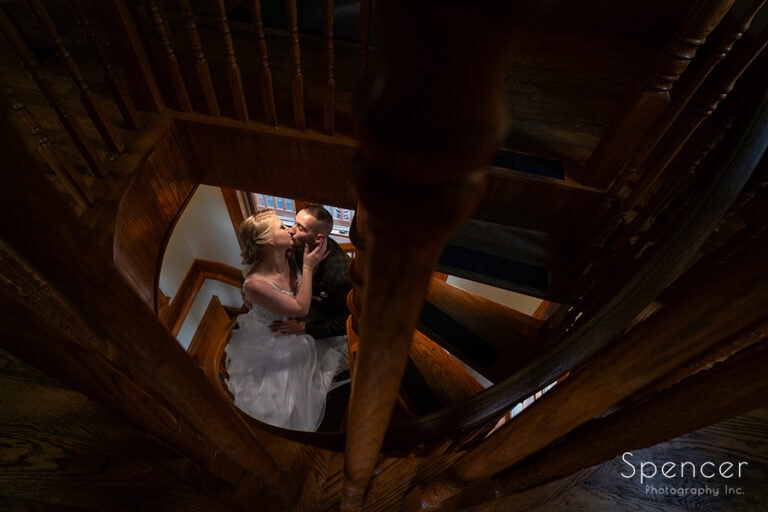 Cleveland bridal couple kissing on staircase