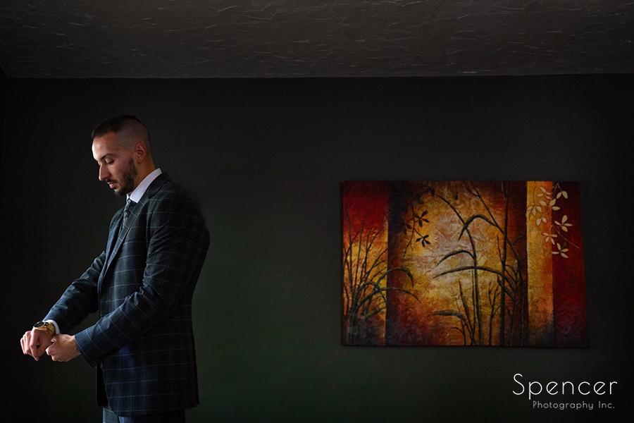 groom prepping for his wedding at Landolls Mohican Castle
