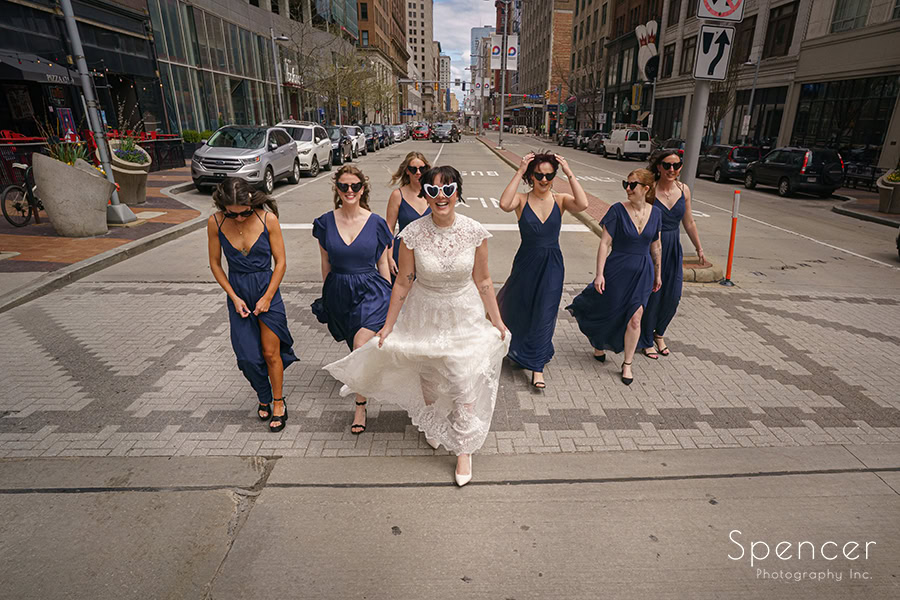 bride walking with bridesmaids in outside Cleveland Arcade